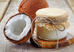 Fresh coconut and jar of coconut oil