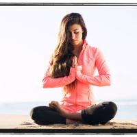 Woman on mat doing yoga
